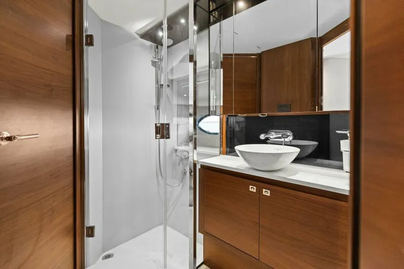 Slide: The Image of Luxurious bathroom in 2016 Princess 60 Flybridge yacht with modern fixtures and wood accents. - 47
