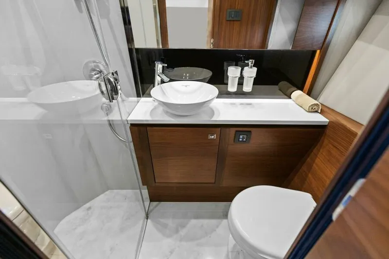 Slide: The Image of Luxurious bathroom in 2016 Princess 60 Flybridge yacht with modern fixtures and elegant design. - 49