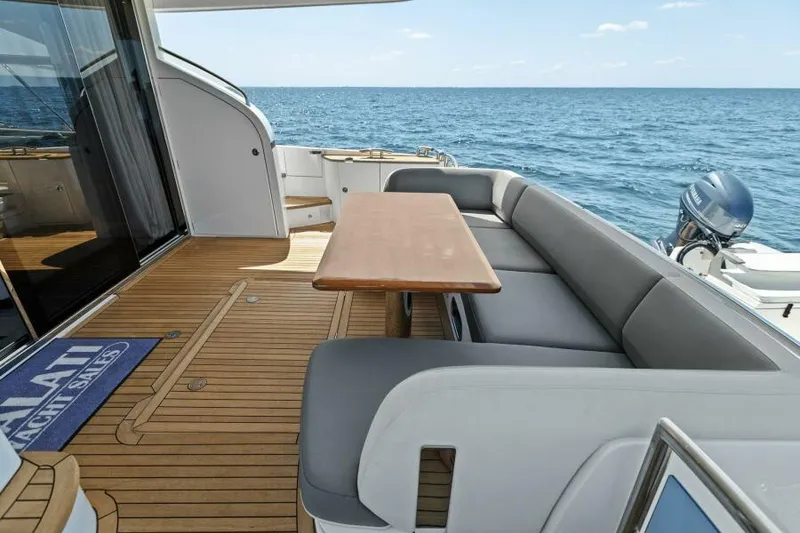 Slide: The Image of Luxurious 2016 Princess 60 Flybridge yacht with elegant deck seating and ocean view. - 8