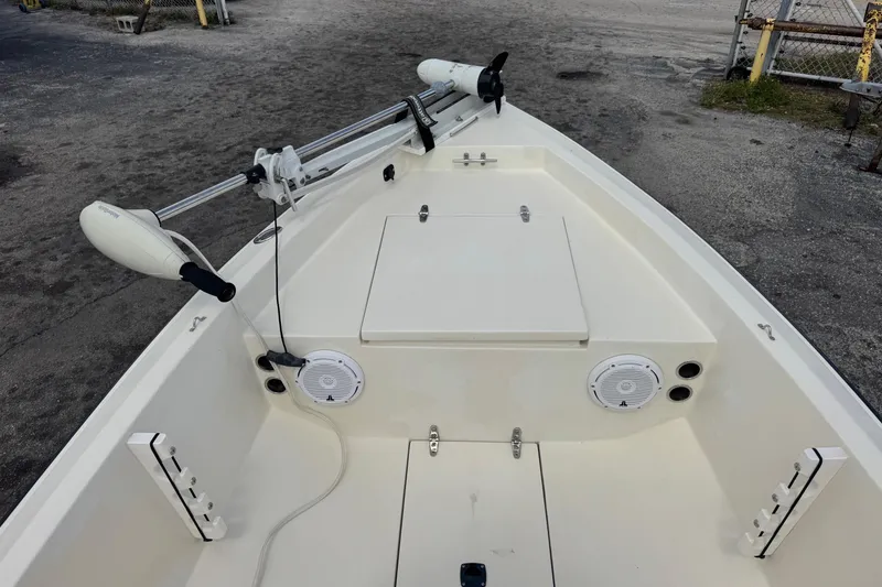 Slide: The Image of 1991 Hoog Comet 14 boat interior with trolling motor and speakers. - 11