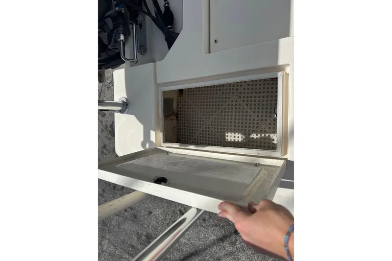 Slide: The Image of Open compartment on a 1991 Hoog Comet 14 boat, showing interior details. - 19