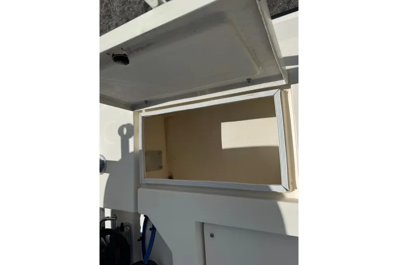 Slide: The Image of Open storage compartment on a 1991 Hoog Comet 14 boat. - 20