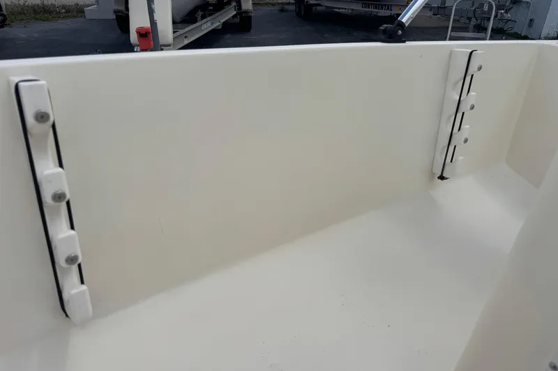 Slide: The Image of Interior view of a 1991 Hoog Comet 14 boat, showcasing clean white surfaces. - 23