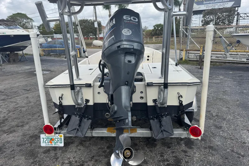 Slide: The Image of 1991 Hoog Comet 14 boat with Yamaha 60 outboard motor, parked on a trailer. - 27
