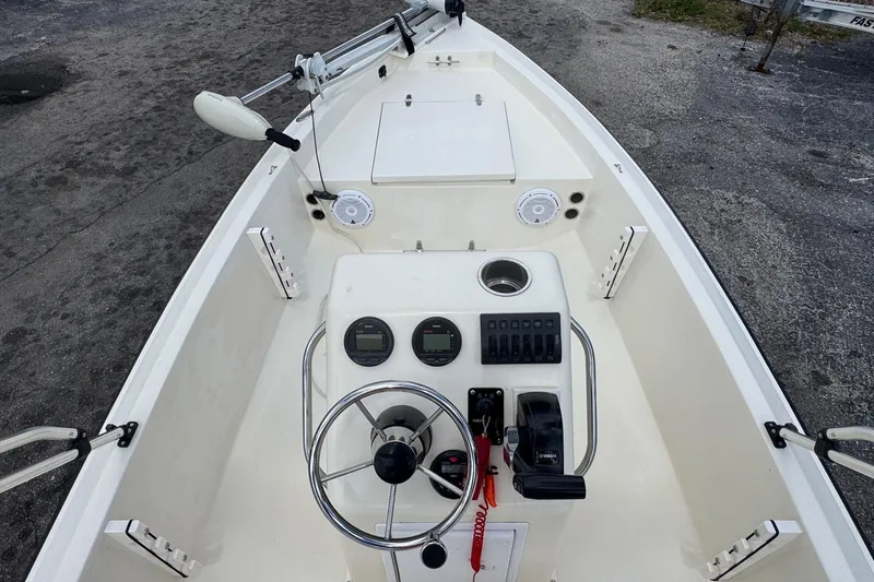 Slide: The Image of 1991 Hoog Comet 14 boat interior with steering wheel and control panel. - 5