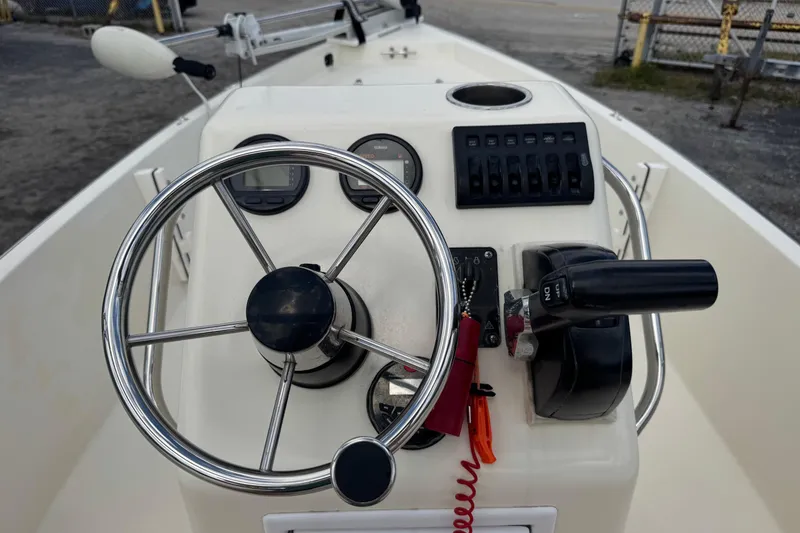 Slide: The Image of Steering console of a 1991 Hoog Comet 14 boat with controls and gauges. - 6