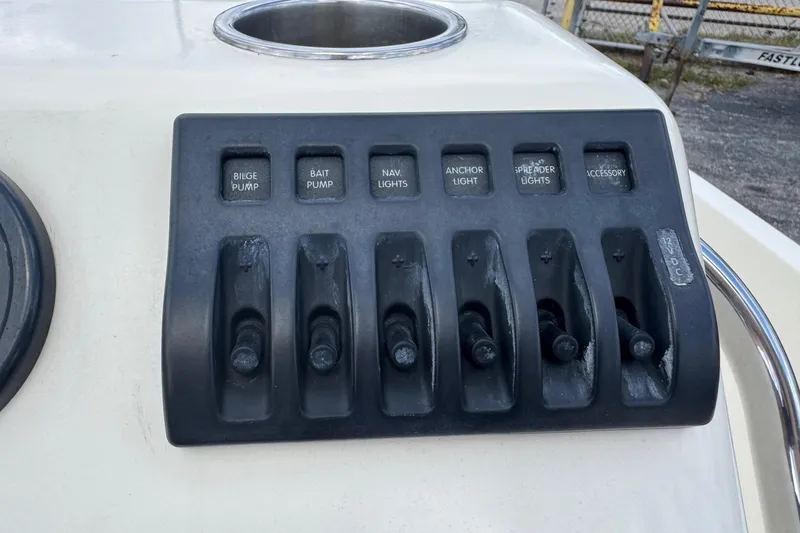 Slide: The Image of Control panel of a 1991 Hoog Comet 14 boat with labeled switches. - 8