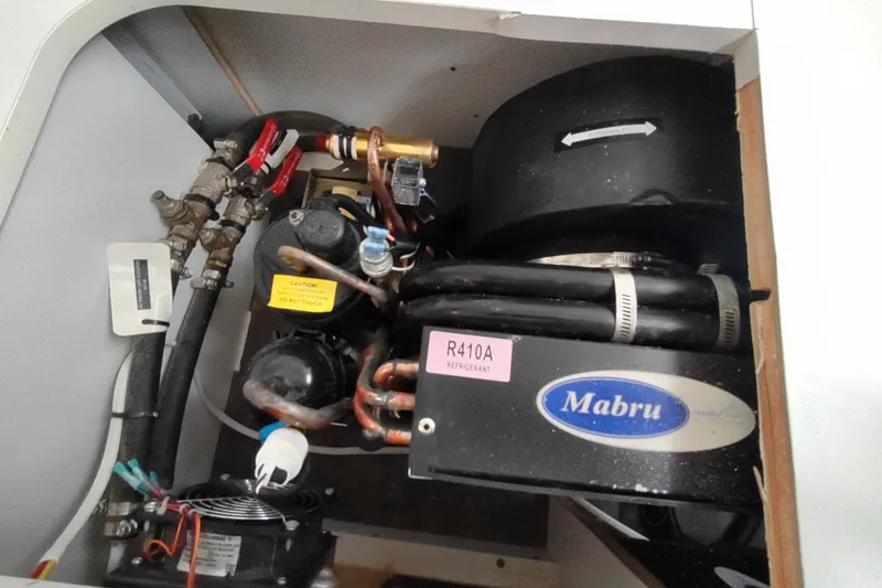 Slide: The Image of Air conditioning unit in a 2020 Outremer 51 yacht, featuring Mabru components and R410A refrigerant. - 102