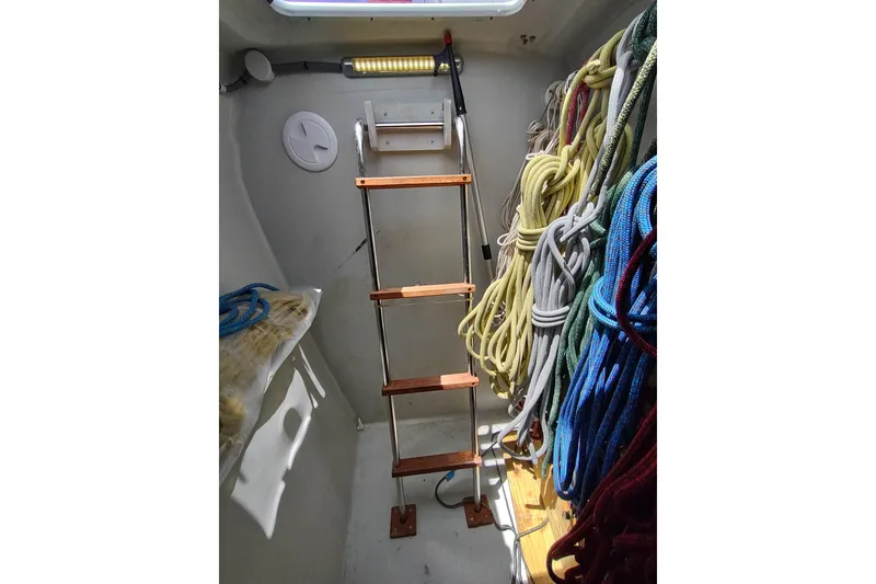 Slide: The Image of Interior of 2020 Outremer 51 sailboat with ladder and organized ropes. - 103