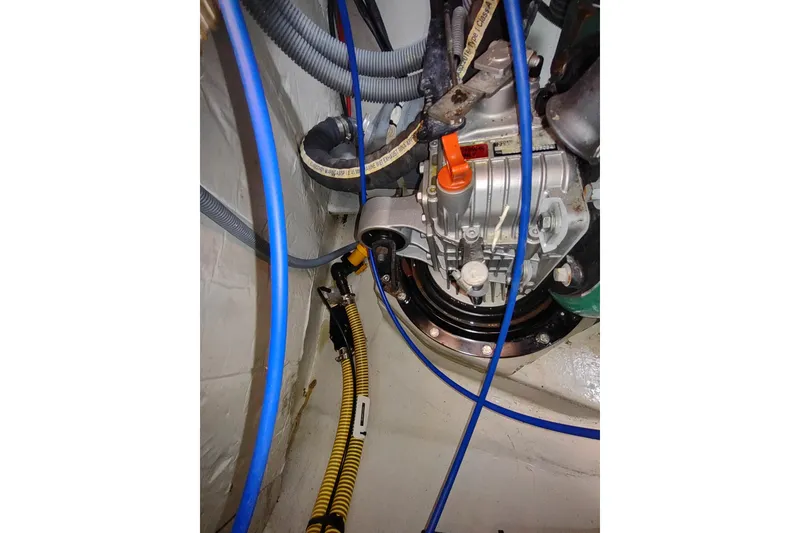 Slide: The Image of Engine compartment of 2020 Outremer 51 sailboat with visible hoses and components. - 117