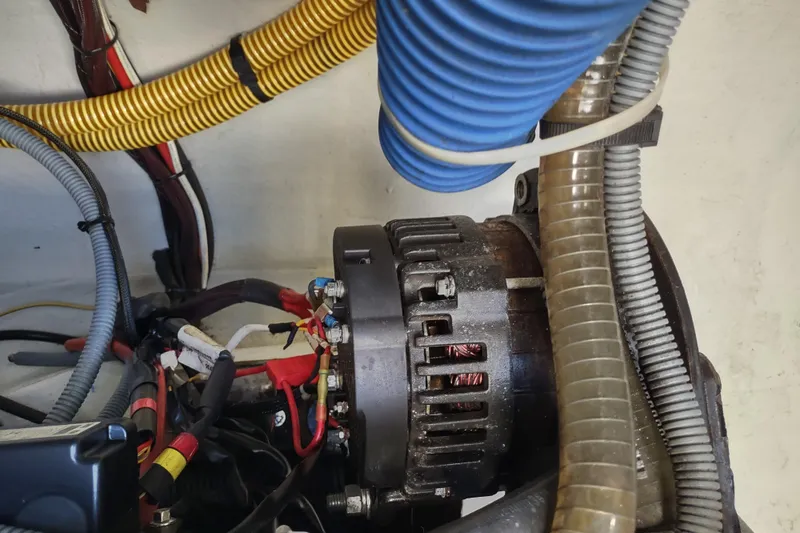 Slide: The Image of Engine compartment of a 2020 Outremer 51, featuring wiring and components. - 122