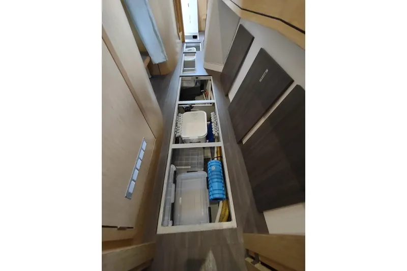 Slide: The Image of Interior view of 2020 Outremer 51 yacht, showcasing underfloor storage compartments. - 124
