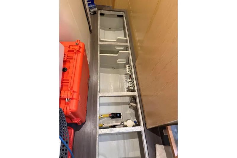 Slide: The Image of Interior view of 2020 Outremer 51 yacht showing storage compartments and equipment. - 128