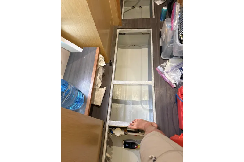 Slide: The Image of Interior view of 2020 Outremer 51 yacht, showing storage compartments and flooring. - 129