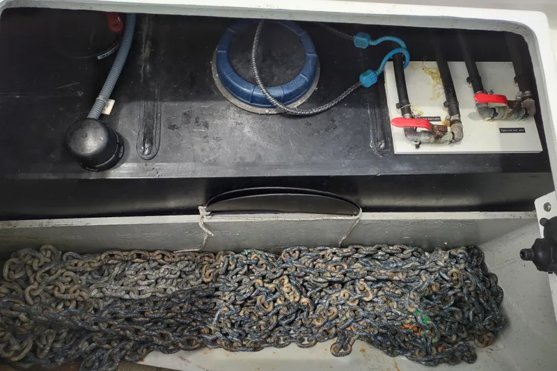 Slide: The Image of Anchor chain and plumbing system in 2020 Outremer 51 yacht compartment. - 135