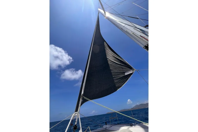 Slide: The Image of Outremer 51 sailboat sailing under clear blue sky, 2020 model. - 14