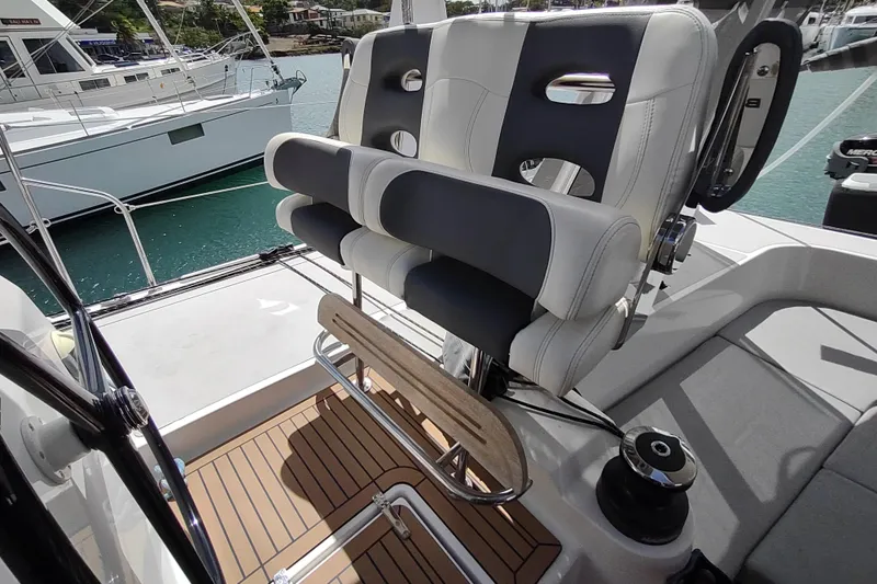 Slide: The Image of Luxury seating on 2020 Outremer 51 catamaran, featuring sleek design and comfortable upholstery. - 140