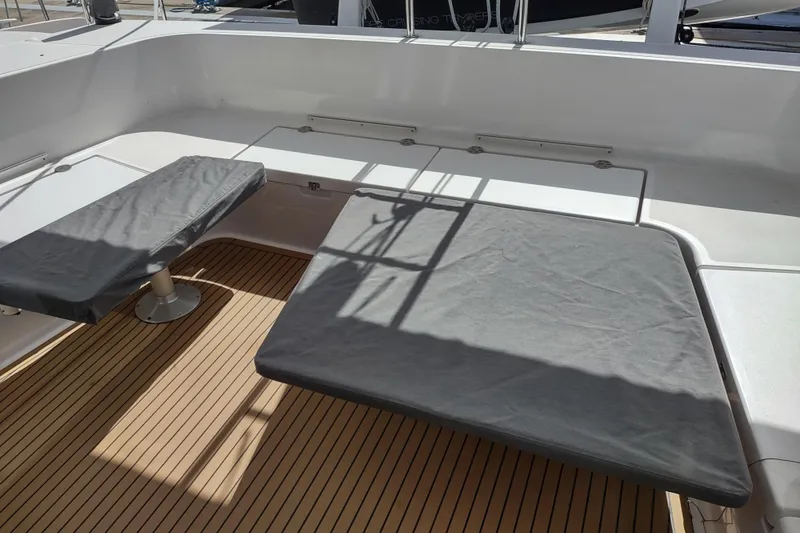 Slide: The Image of 2020 Outremer 51 yacht cockpit with cushioned seating and teak flooring. - 142