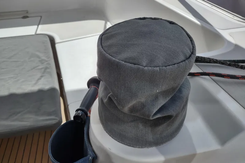 Slide: The Image of Winch cover on 2020 Outremer 51 catamaran deck, showcasing marine equipment. - 143