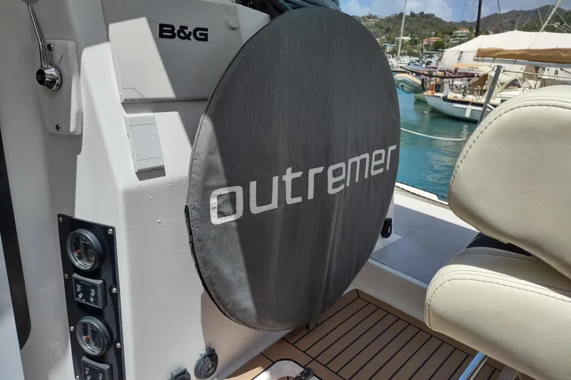 Slide: The Image of 2020 Outremer 51 yacht cockpit with B&G equipment and Outremer branding. - 145