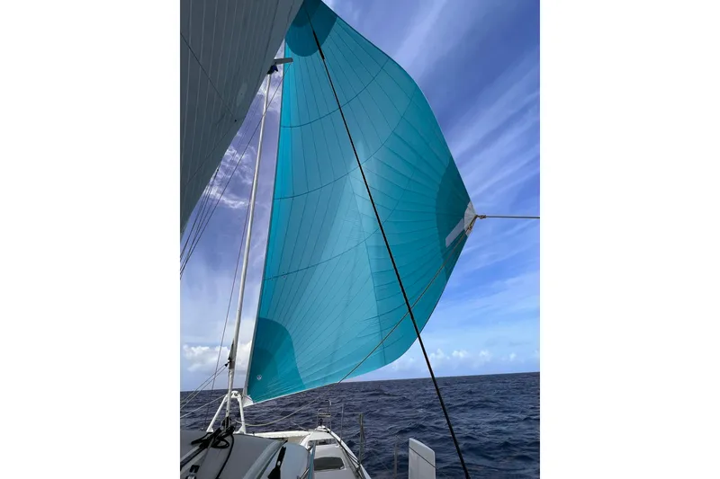 Slide: The Image of Outremer 51 sailboat with blue sail against clear sky, 2020 model. - 15