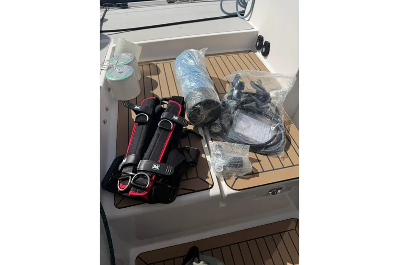 Slide: The Image of Diving equipment on 2020 Outremer 51 yacht deck, featuring harness and hoses. - 151