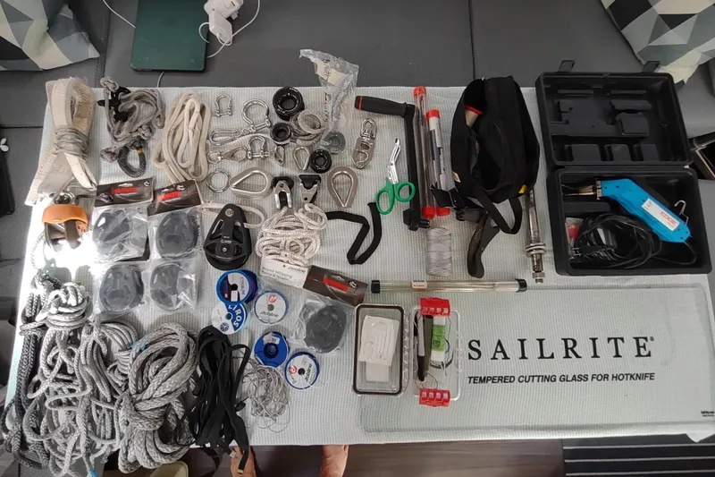 Slide: The Image of Assorted sailing equipment and tools on a Sailrite mat, Outremer 51, 2020 model. - 152