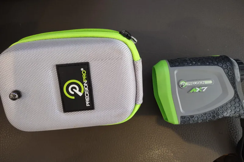 Slide: The Image of Precision Pro NX7 rangefinder with gray and green carrying case. - 159