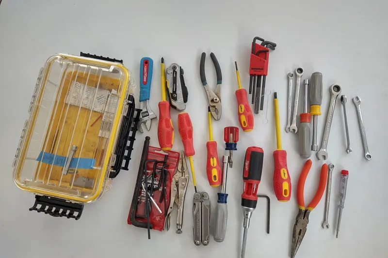 Slide: The Image of Assorted tools and toolbox for Outremer 51, 2020 model, neatly arranged on a white surface. - 165