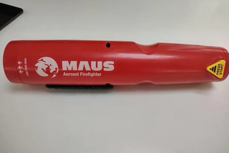 Slide: The Image of Red MAUS aerosol firefighter with "Press Start" button, designed for emergency fire suppression. - 168