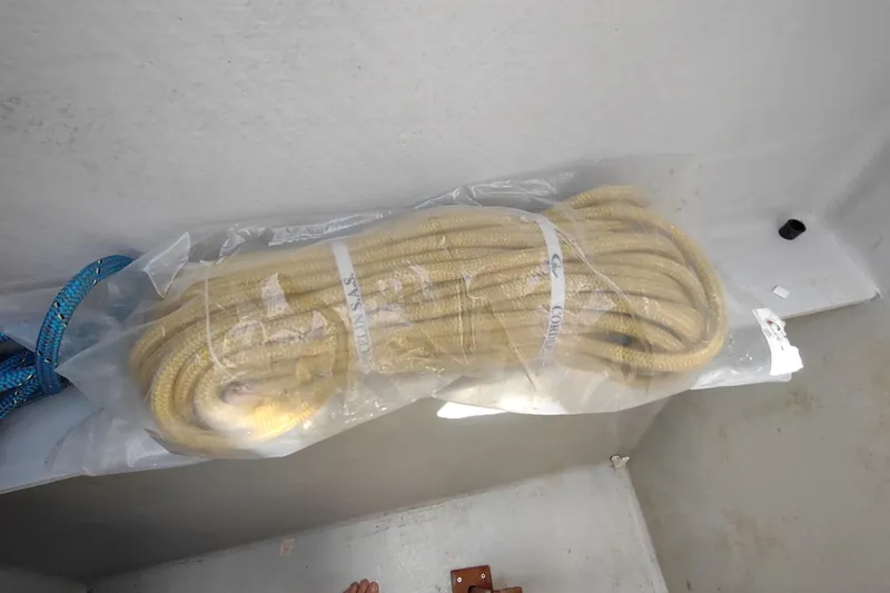 Slide: The Image of Coiled rope on Outremer 51 catamaran, 2020 model, in plastic packaging. - 180