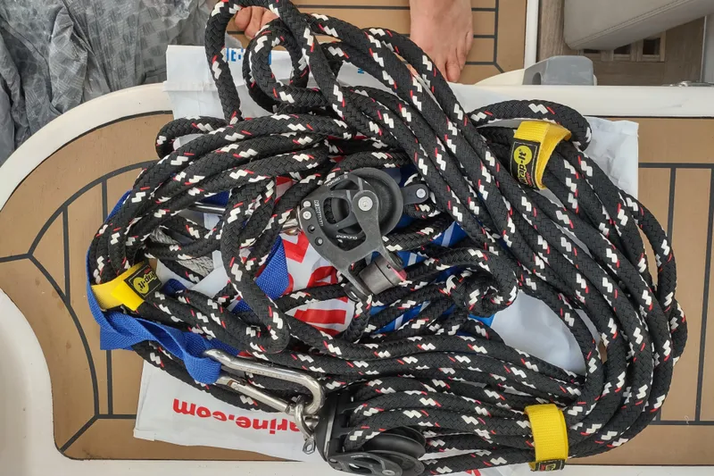 Slide: The Image of Coiled sailing ropes and hardware on Outremer 51 catamaran deck, 2020 model. - 189