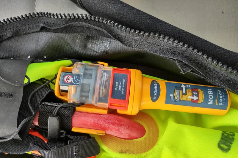 Slide: The Image of Safety equipment on 2020 Outremer 51, featuring a rescueME MOB1 device in a zippered pouch. - 195