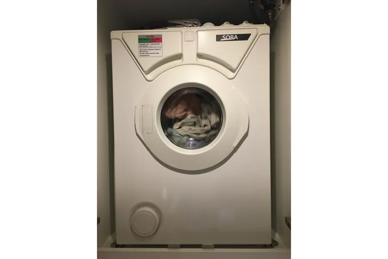 Slide: The Image of Compact washing machine in a 2020 Outremer 51 yacht interior. - 198