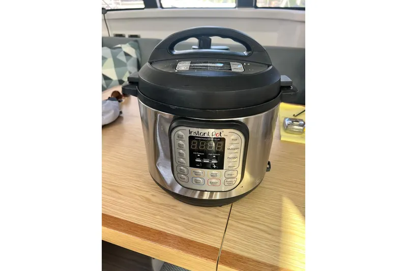 Slide: The Image of Instant Pot on wooden table inside 2020 Outremer 51 catamaran kitchen. - 203