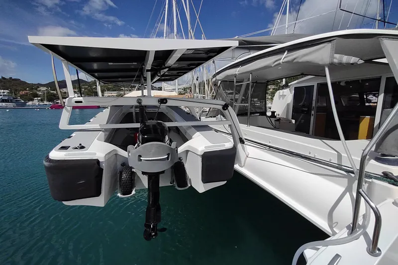 Slide: The Image of Outremer 51 catamaran, 2020 model, docked in a marina with solar panels. - 23