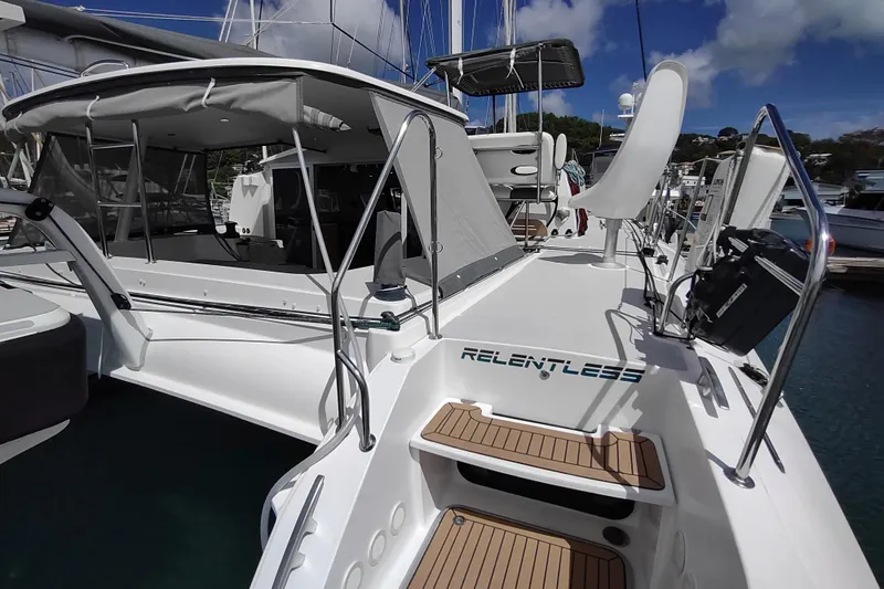 Slide: The Image of 2020 Outremer 51 catamaran docked, featuring spacious deck and modern design. - 24