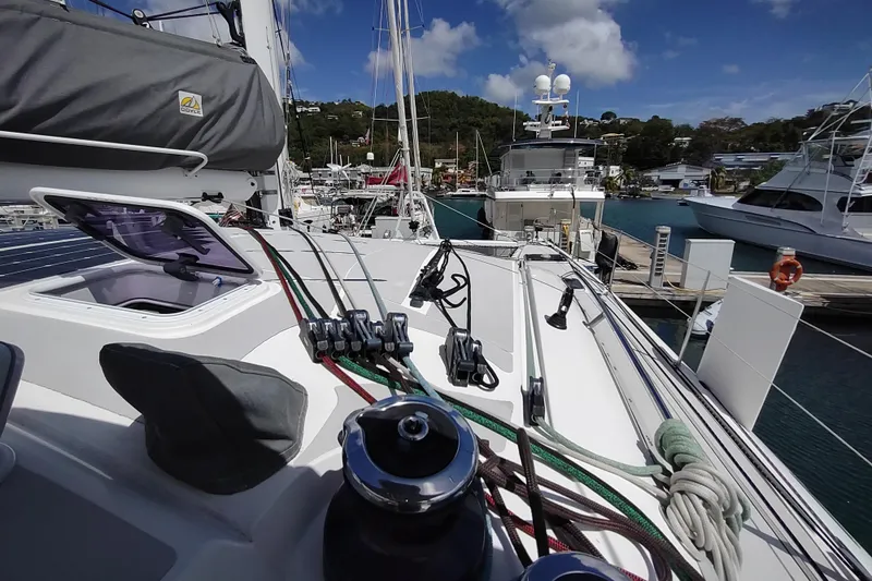Slide: The Image of Outremer 51 catamaran docked at marina, showcasing deck and rigging, 2020 model. - 26