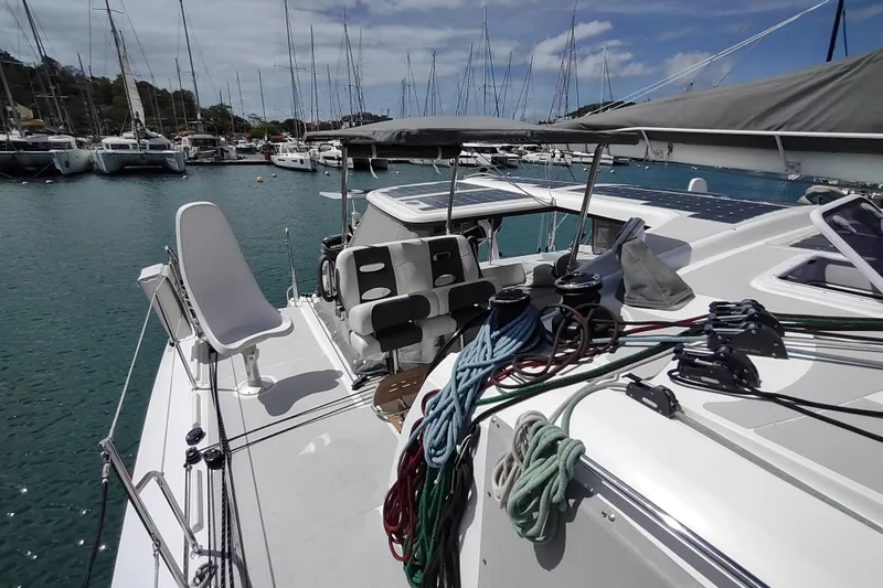 Slide: The Image of 2020 Outremer 51 catamaran docked in marina, featuring deck and rigging details. - 27