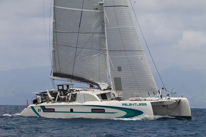 Slide: The Image of 2020 Outremer 51 catamaran sailing on open sea with full sails. - 3