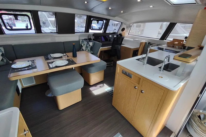 Slide: The Image of Modern interior of 2020 Outremer 51 catamaran with dining area and kitchen. - 48