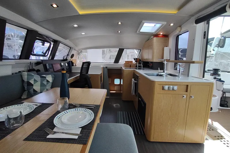 Slide: The Image of Modern interior of 2020 Outremer 51 yacht with dining and kitchen area. - 50