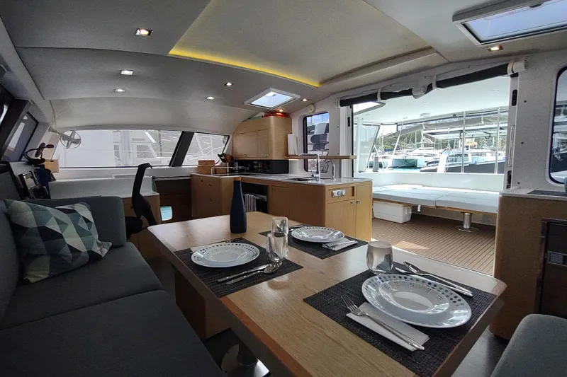 Slide: The Image of Luxurious interior of 2020 Outremer 51 catamaran with modern dining and kitchen area. - 53