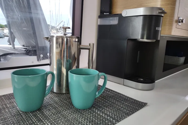 Slide: The Image of Coffee setup on 2020 Outremer 51 yacht with Keurig machine and turquoise mugs. - 57