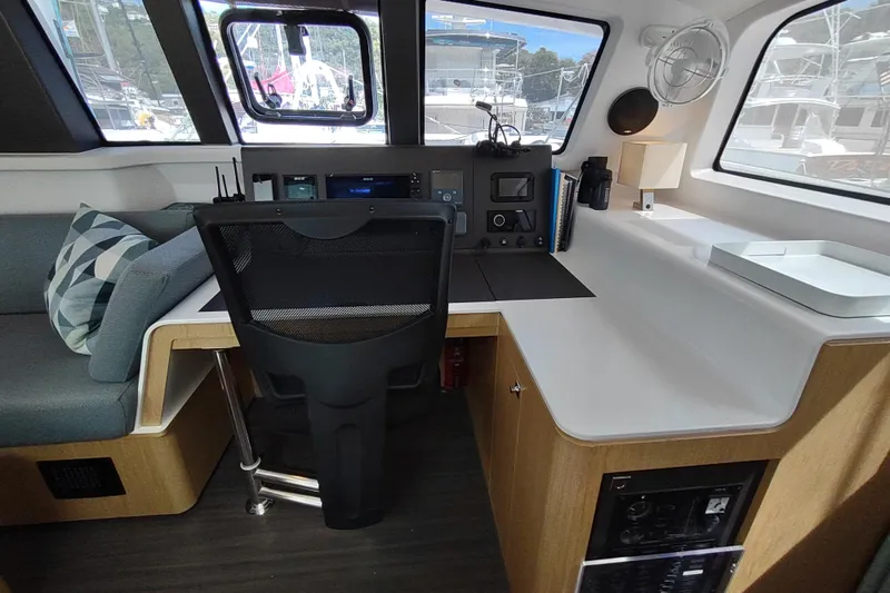 Slide: The Image of Interior of 2020 Outremer 51 yacht with modern navigation station and seating area. - 58