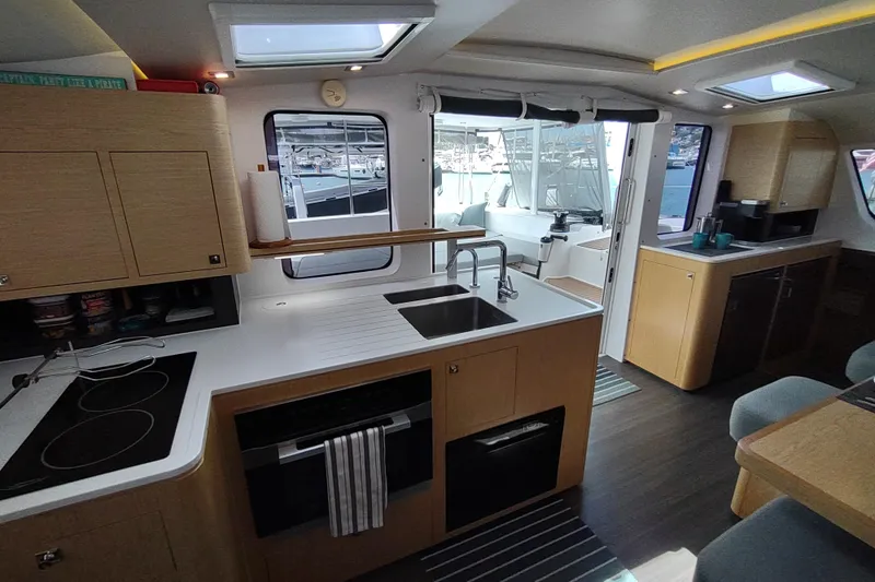 Slide: The Image of Modern kitchen interior of 2020 Outremer 51 catamaran with sleek design and ample natural light. - 62