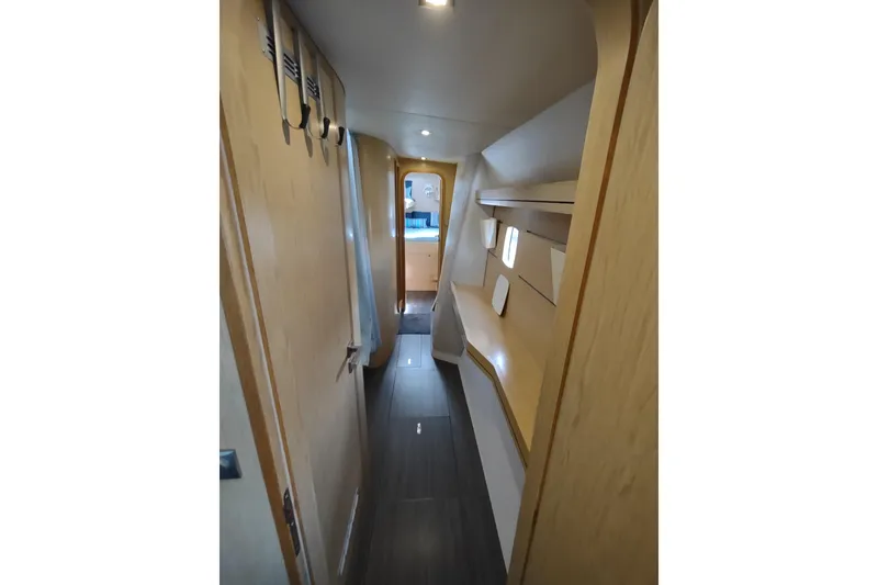 Slide: The Image of Interior hallway of 2020 Outremer 51 catamaran, featuring modern wood finishes and sleek design. - 64
