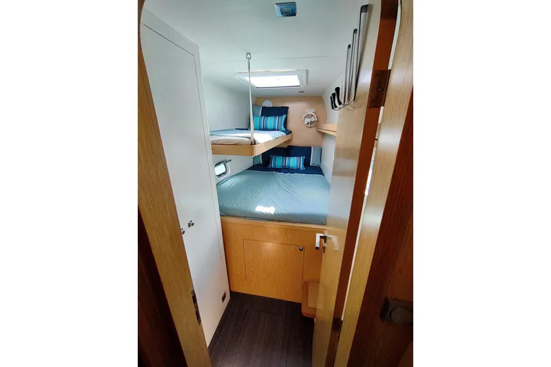 Slide: The Image of Interior of 2020 Outremer 51 yacht cabin with bunk beds and modern design. - 66