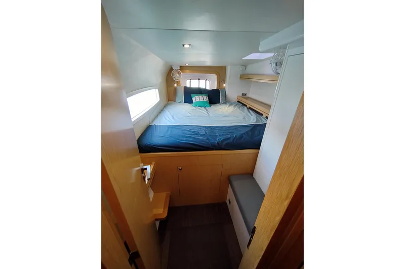 Slide: The Image of Cozy cabin interior of 2020 Outremer 51 yacht with bed and storage shelves. - 71