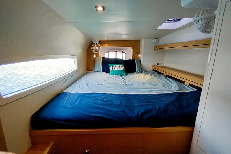 Slide: The Image of Cozy bedroom in 2020 Outremer 51 yacht with ocean view window. - 72